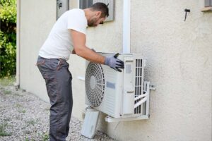 Energy-efficient air source heat pump in action, showing how it works to transfer heat from outside air into the home