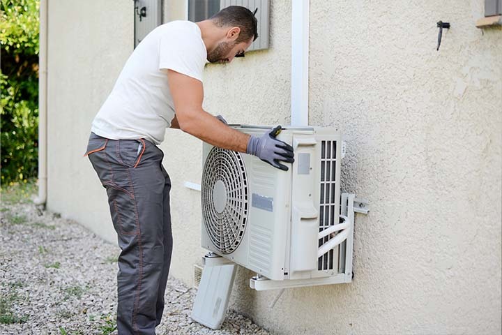 Energy-efficient air source heat pump in action, showing how it works to transfer heat from outside air into the home