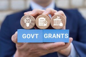 Happy UK homeowner receiving free government grant approval letter