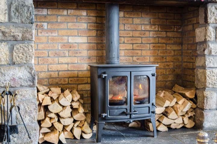 Old back boiler system in a UK home being replaced with a modern energy-efficient boiler
